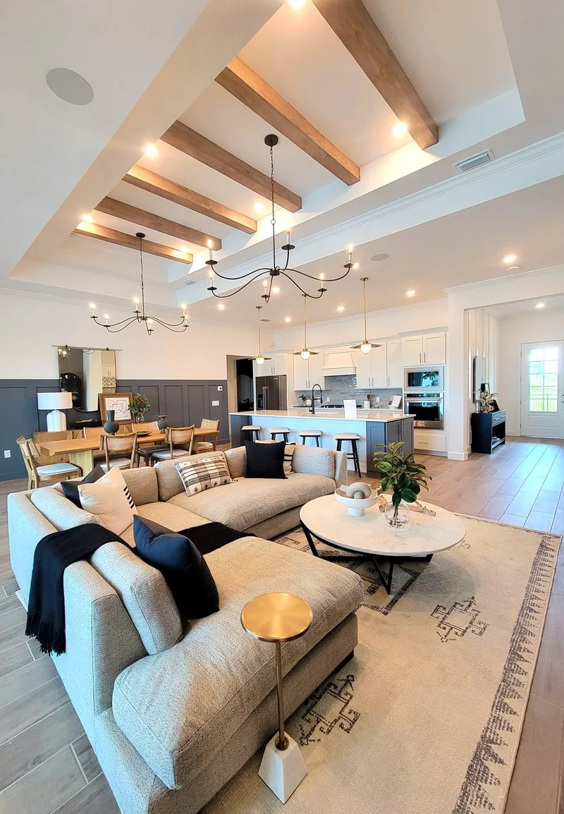 Open interior with a ceiling fan and natural light
