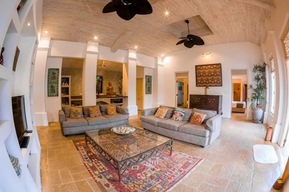 Airy residential living room with a ceiling fan